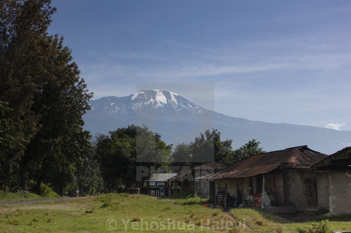 "Tanzanian village and Mt. Kilimanjaro" by Yehoshua Halevi - $6.08 "Tanzanian village and Mt. Kilimanjaro" stock image