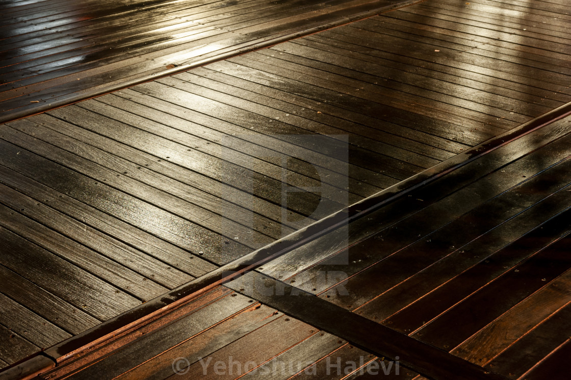 "Bright colored lights on wet decking" by Yehoshua Halevi - $4.87 "Bright colored lights on wet decking" stock image