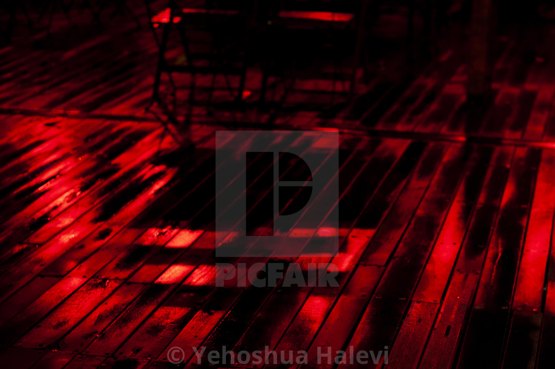 "Bright colored lights on wet decking at night" by Yehoshua Halevi - $4.90 "Bright colored lights on wet decking at night" stock image