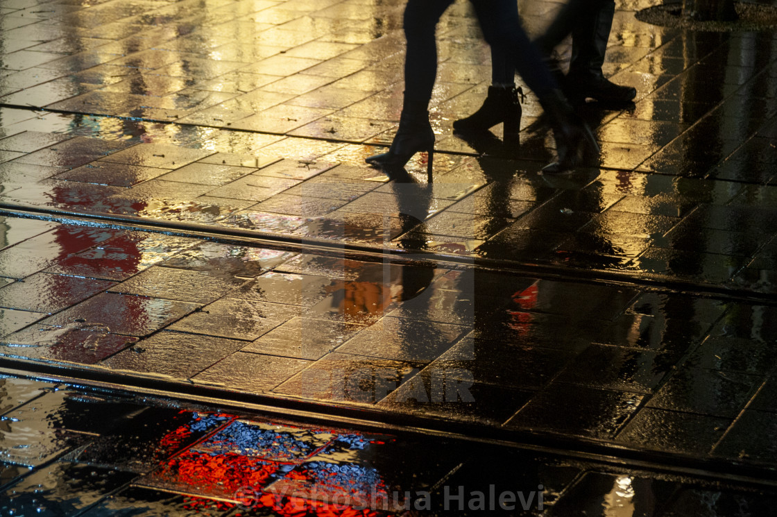 "Bright colored lights on wet pavement at night" by Yehoshua Halevi - $4.90 "Bright colored lights on wet pavement at night" stock image