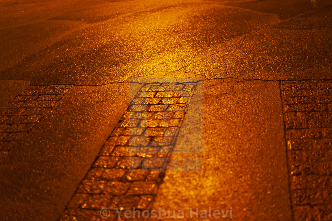 "Bright colored lights on wet pavement at night" by Yehoshua Halevi - $4.90 "Bright colored lights on wet pavement at night" stock image
