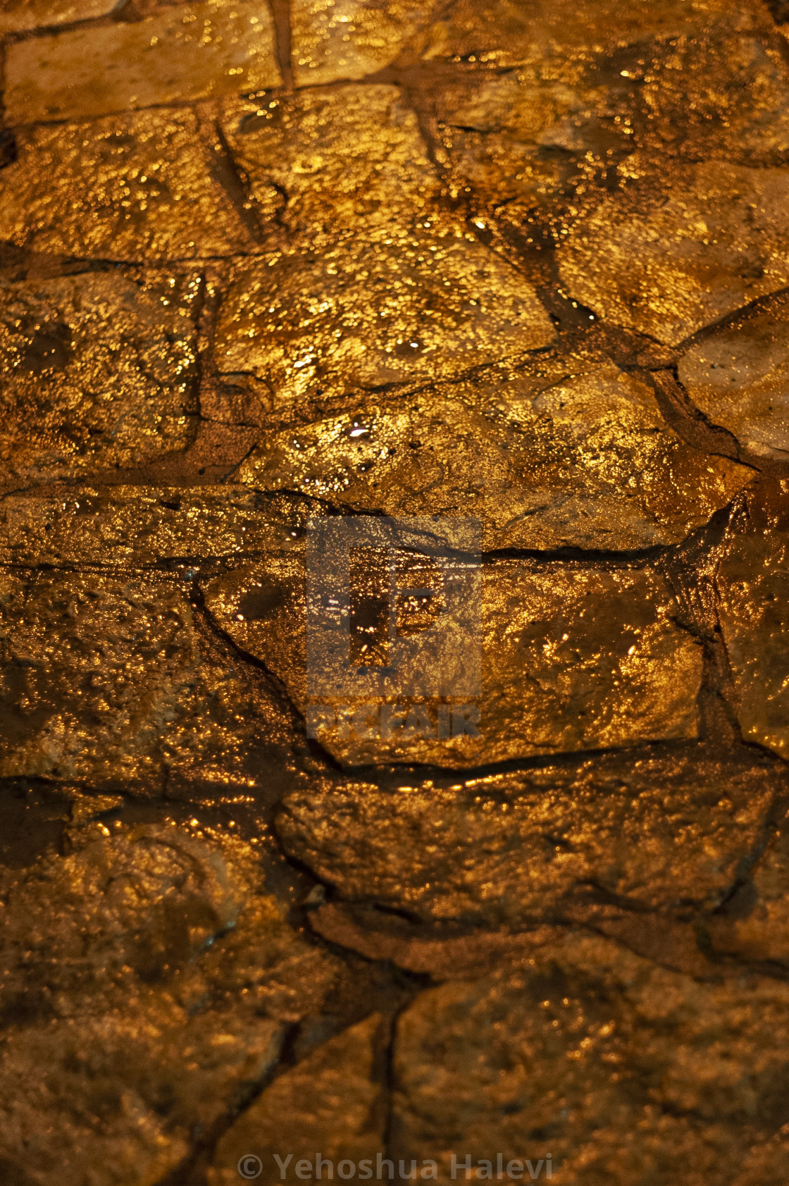 "Bright colored lights on wet stone pavement at night" by Yehoshua Halevi - $4.90 "Bright colored lights on wet stone pavement at night" stock image