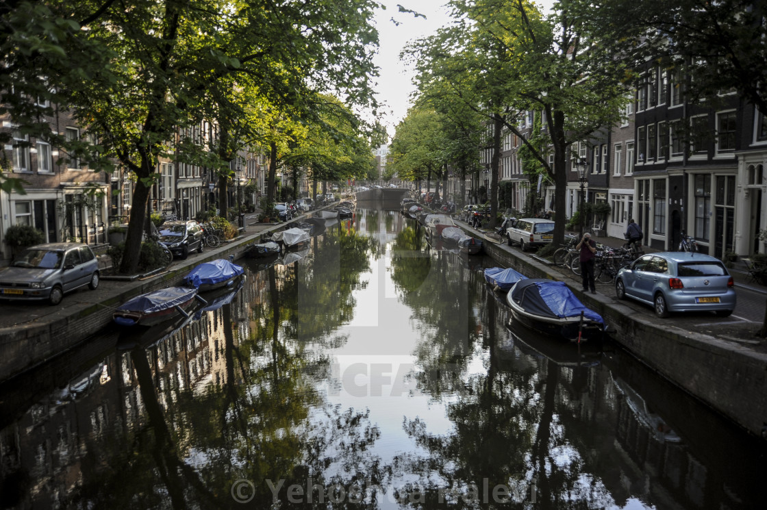 "Boats and trees reflected in an Amsterdam canal" by Yehoshua Halevi - $6.08 "Boats and trees reflected in an Amsterdam canal" stock image