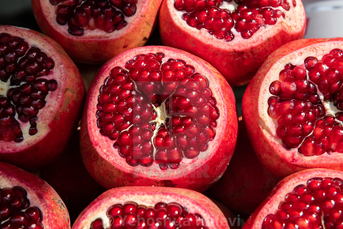 "Ripe pomegranate fruits with their crowns removed to reveal hundreds of juice, red seeds" by Yehoshua Halevi - $6.08 "Ripe pomegranate fruits with their crowns removed to reveal hundreds of juice, red seeds" stock image