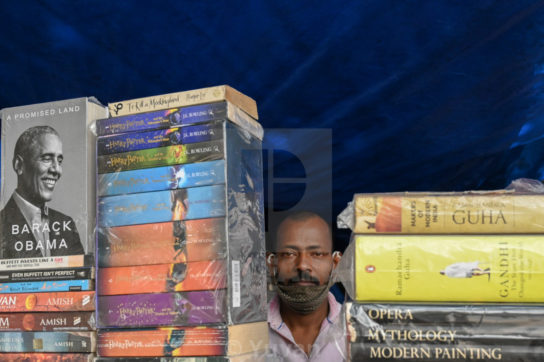 "Indian bookseller" by Yuvan - $12.45 "Indian bookseller" stock image