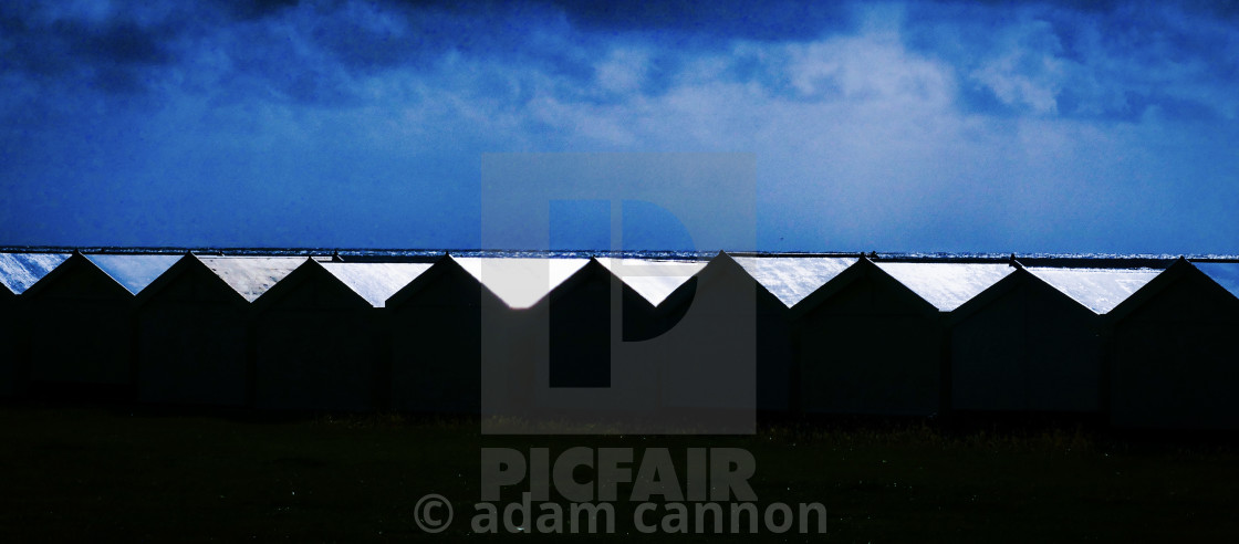 "The beachuts of hove at sunset" stock image