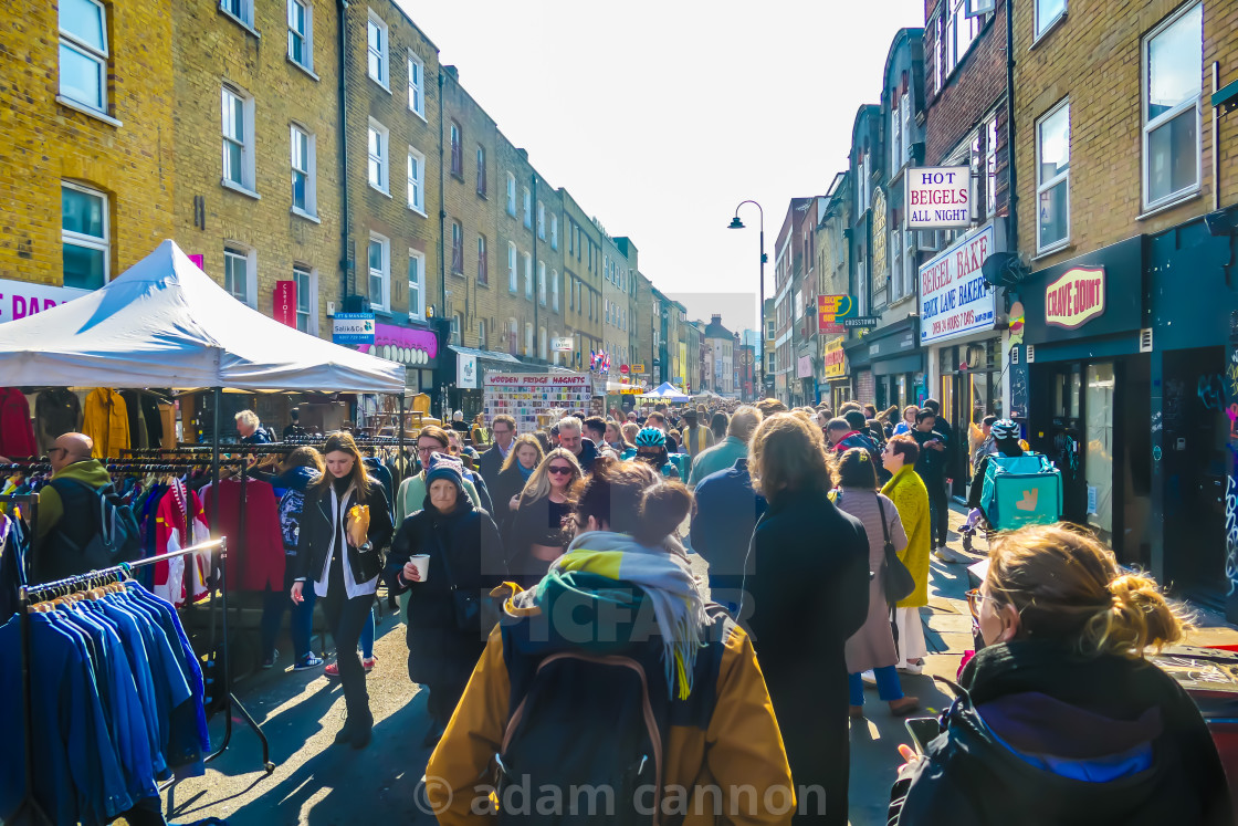 "a busy sunday on brick lane" stock image