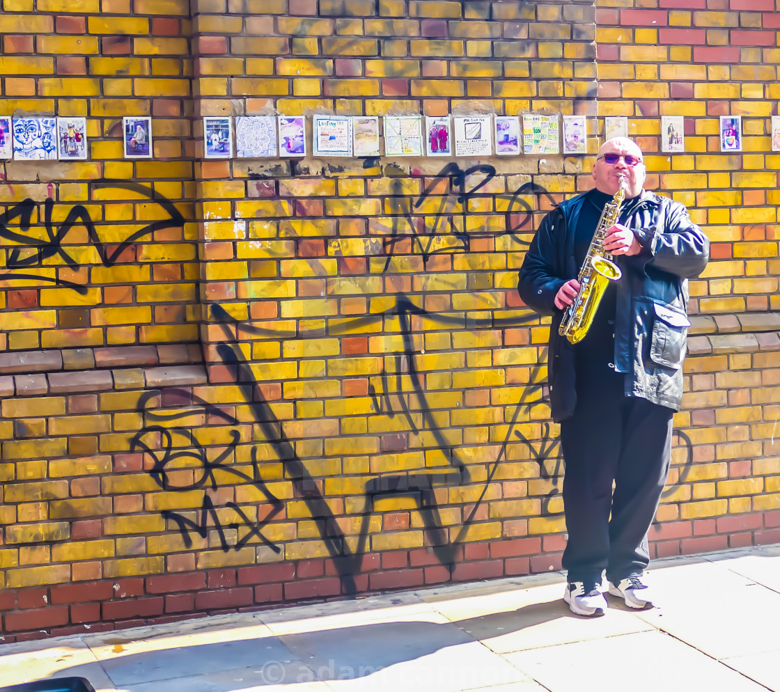 "A saxophonist busker on Brick Lane" stock image