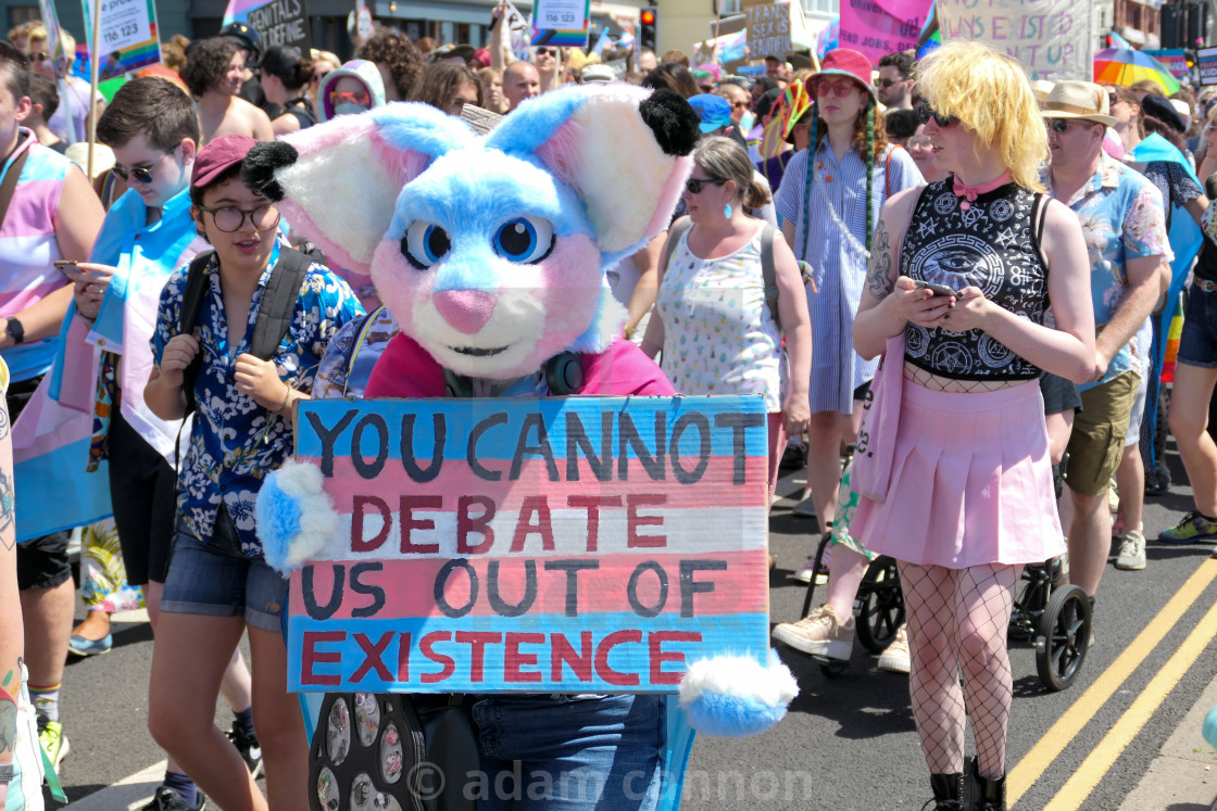 ""you cannot debate us out of existence" sign" stock image