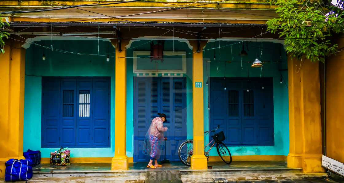 "cleaning up after the Hoi An floods" stock image