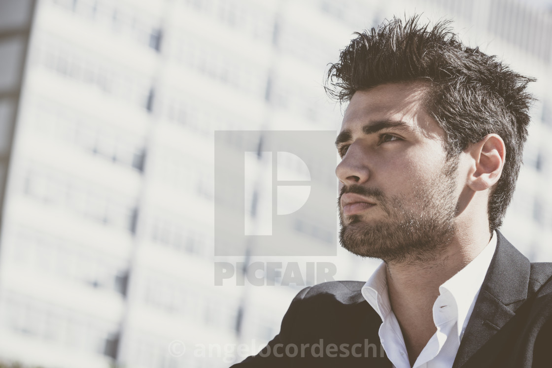 Handsome young man outdoor. Stubble and hairstyle. - License, download or print for £ | Photos | Picfair Handsome young man outdoor. Stubble and hairstyle. - License, download or print for £ | Photos | Picfair