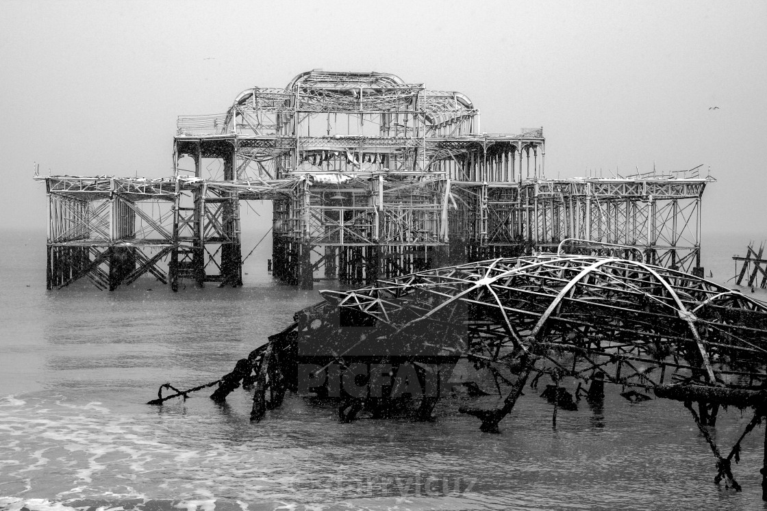 "Winter scene of the ruin of the collapsed West Pier covered in snow in Brighton, UK." by darrylcuz - £6.20 "Winter scene of the ruin of the collapsed West Pier covered in snow in Brighton, UK." stock image