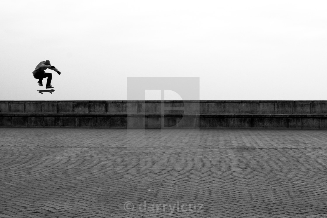 "Low angle shot of a skater grabbing some air on Brighton Seafront in the UK." by darrylcuz - £6.20 "Low angle shot of a skater grabbing some air on Brighton Seafront in the UK." stock image