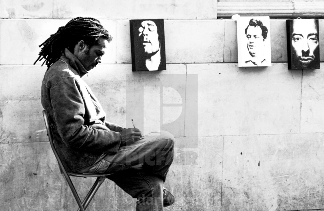"Street shot of an artist selling portrait paintings in The North Laine, Brighton, UK." by darrylcuz - £6.20 "Street shot of an artist selling portrait paintings in The North Laine, Brighton, UK." stock image