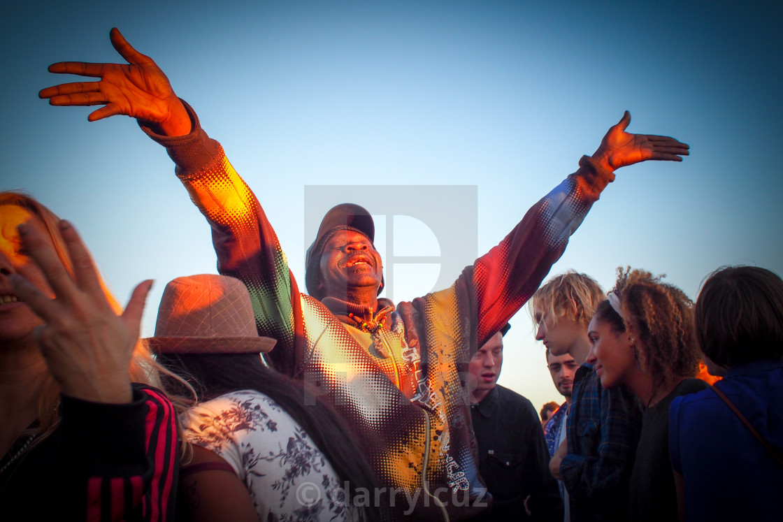 "Man in brightly coloured coat enjoys the music at a Reggae Festival in Hove, UK." by darrylcuz - £6.20 "Man in brightly coloured coat enjoys the music at a Reggae Festival in Hove, UK." stock image