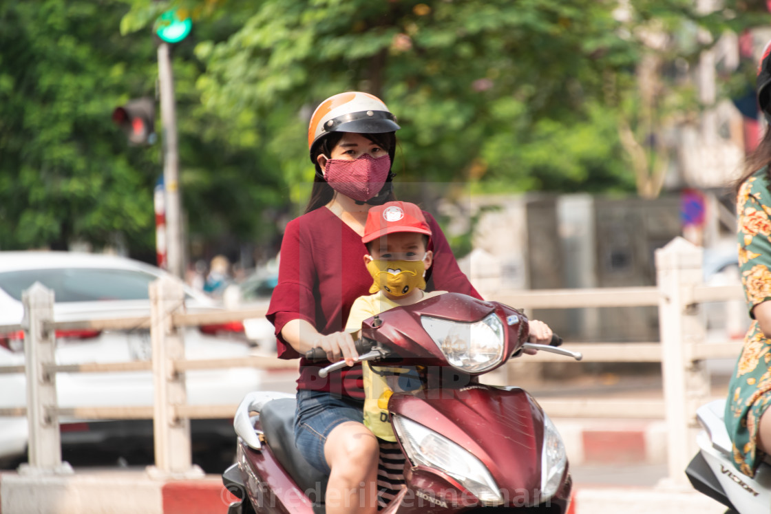 "People in Vietnam wearing facemasks against the air pollution and covid19" stock image