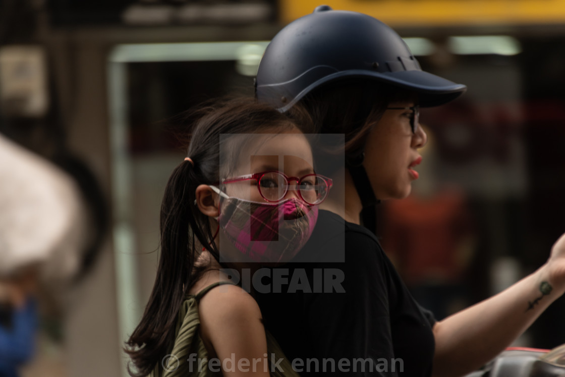 "People in Vietnam wearing facemasks against the air pollution and covid19" stock image