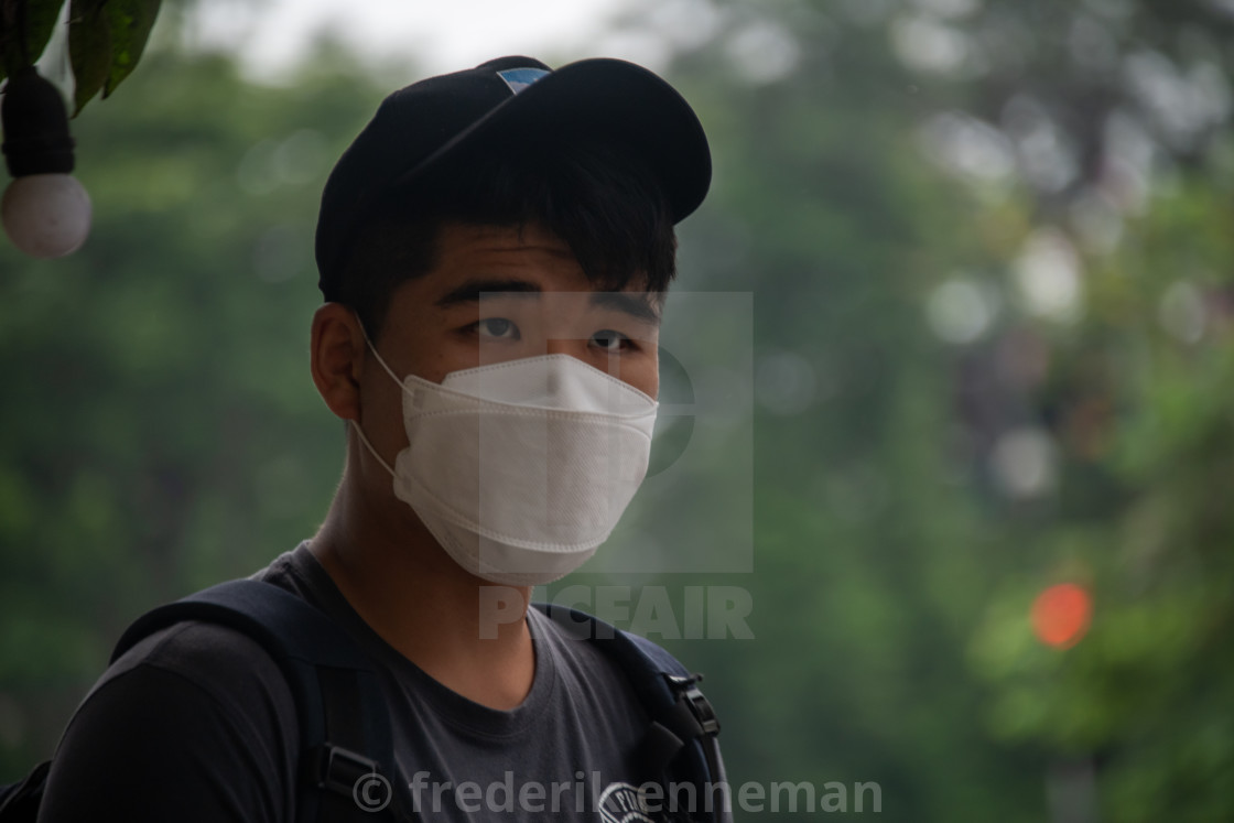 "People in Vietnam wearing facemasks against the air pollution and covid19" stock image