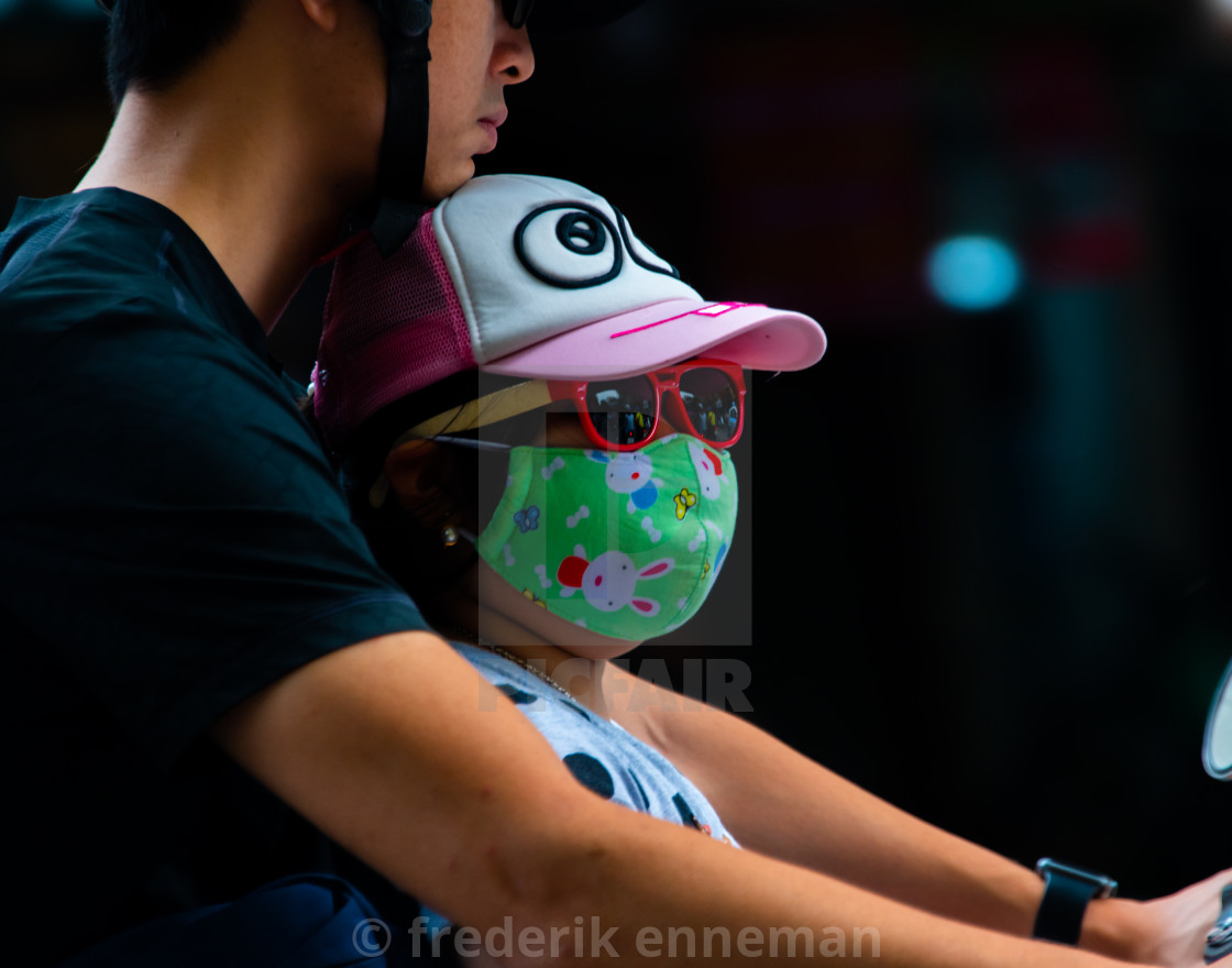 "People in Vietnam wearing facemasks against the air pollution and covid19" stock image