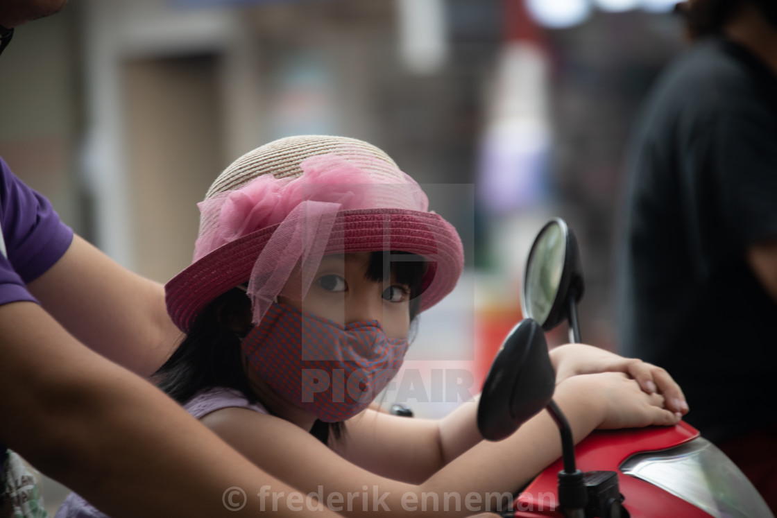 "People in Vietnam wearing facemasks against the air pollution and covid19" stock image