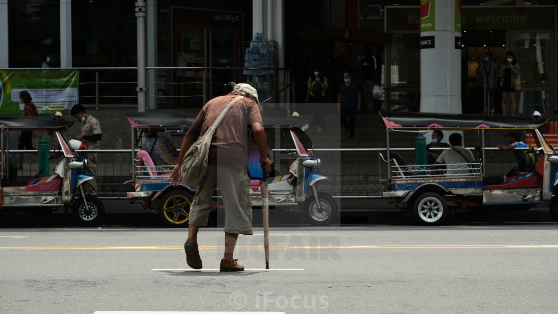 "Old man crosses the big road" stock image