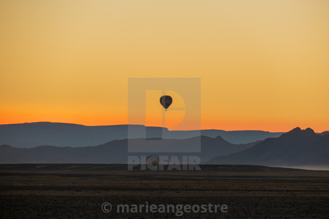 "Namibia, sunrise on hot air ballon in Sossusvlei desert" by - $10.07 "Namibia, sunrise on hot air ballon in Sossusvlei desert" stock image