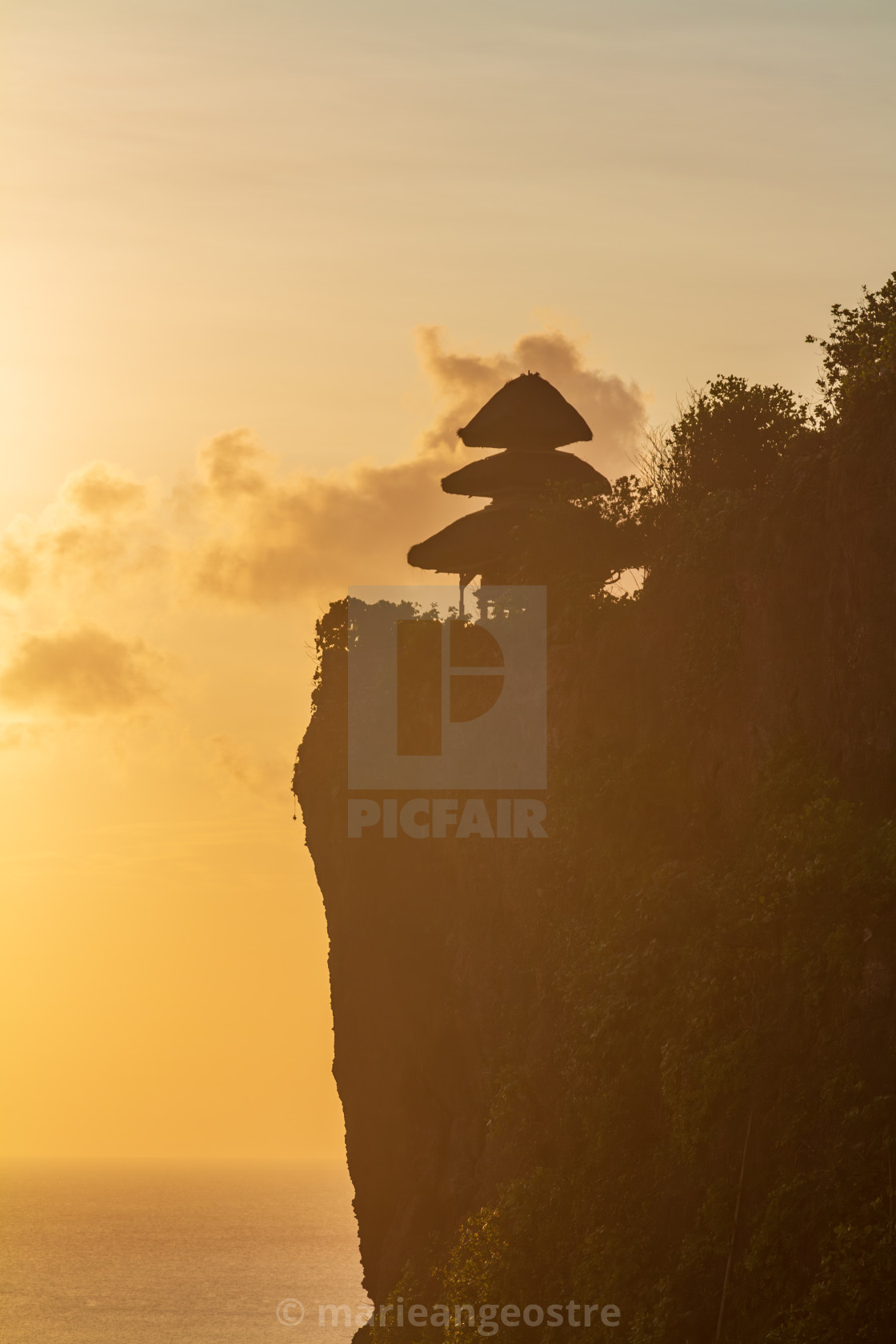 "Bali, Uluwatu temple and cliff at sunset, Indonesia" stock image