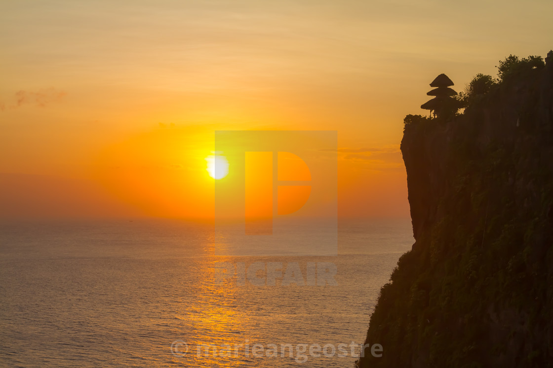 "Bali, Uluwatu temple and cliff at sunset, Indonesia" stock image