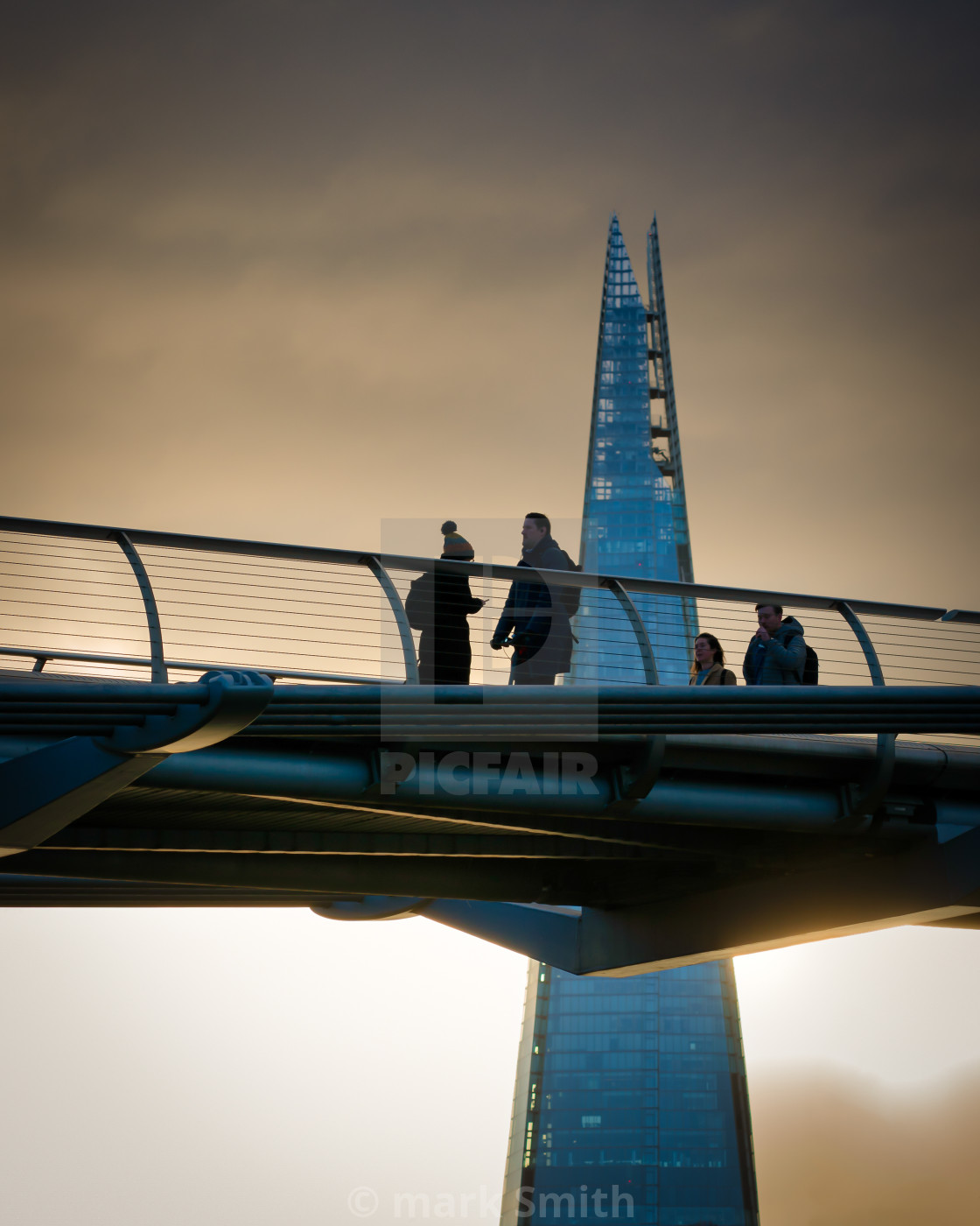 "winter light on millennium bridge" stock image