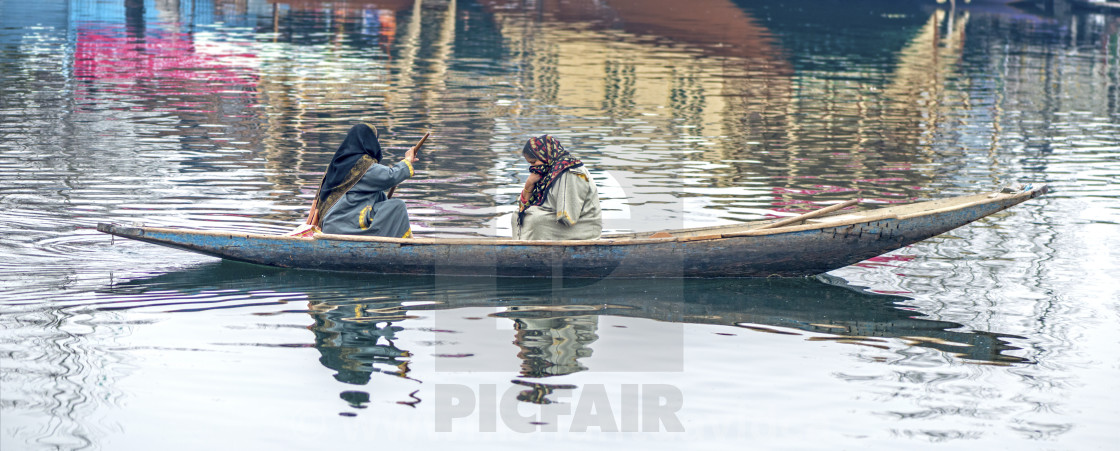 "Two Ladies in a Canoe at Dal Lake" stock image