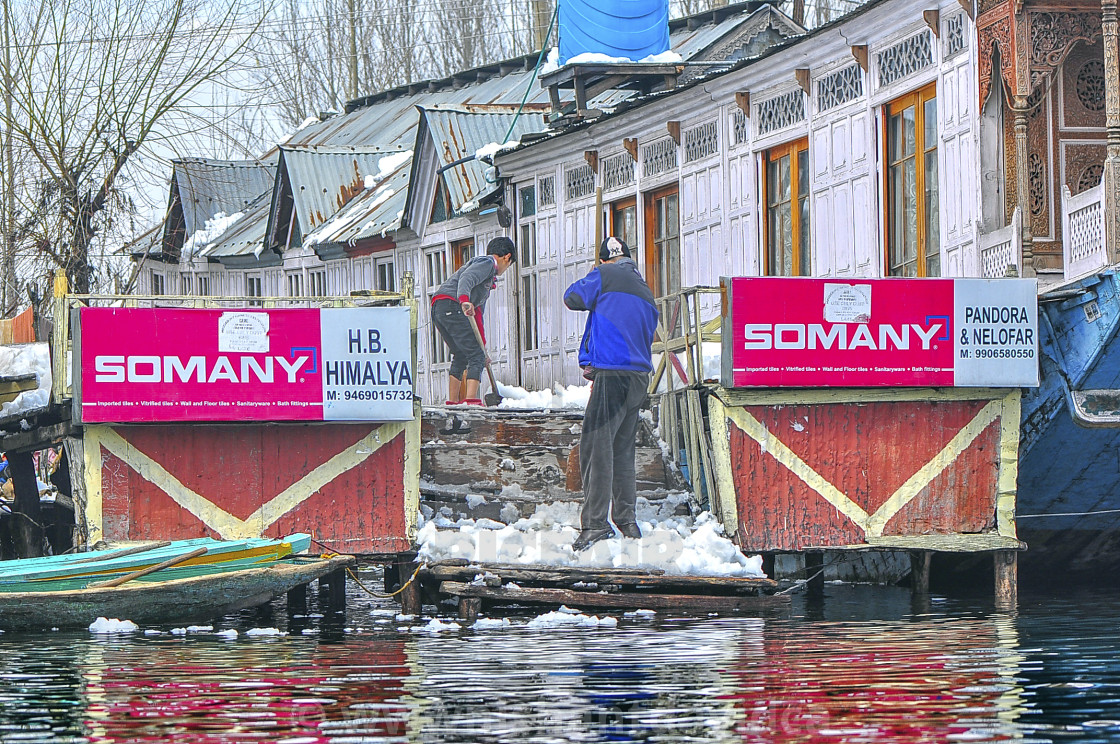 "Snow Removal at a House Boat at Dal Lake, Srinagar" stock image