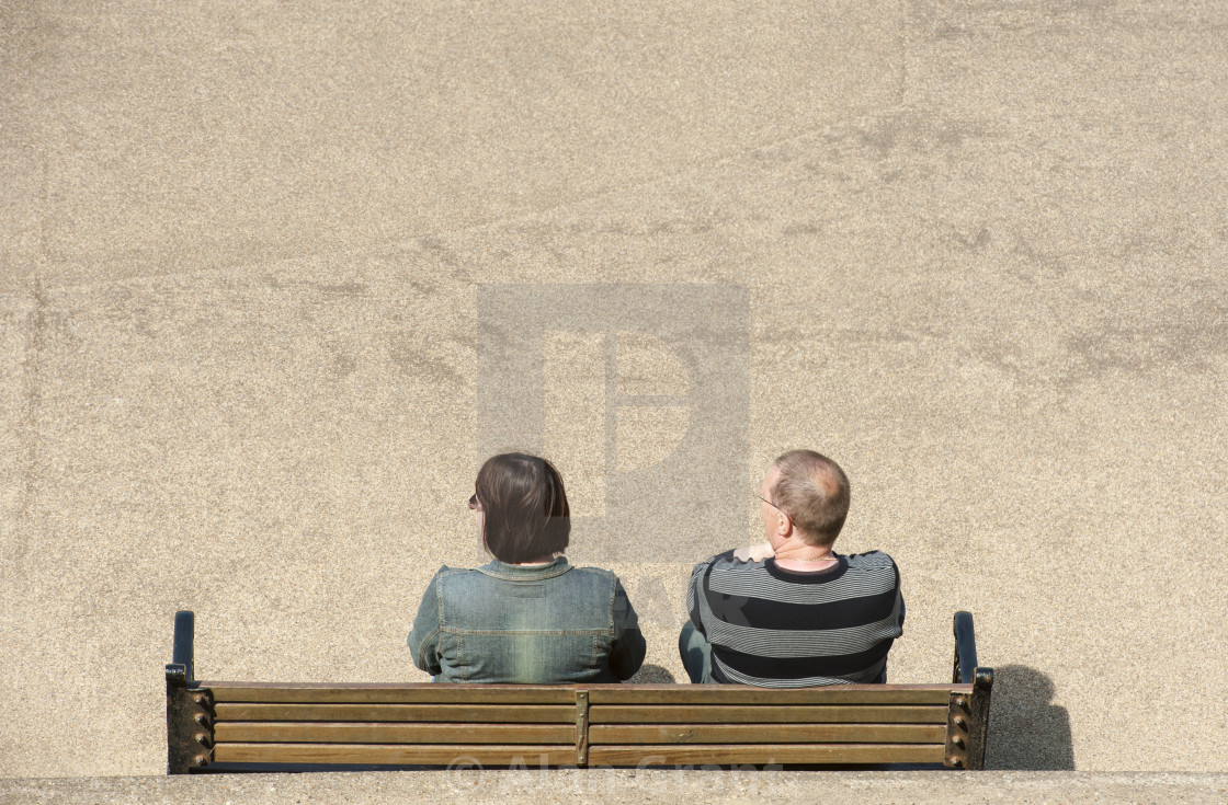"A couple sat on a bench" by Alan Grant - $15.18 "A couple sat on a bench" stock image