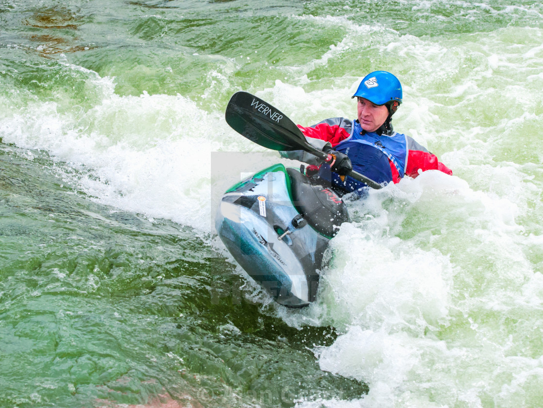 "Kayaker paddling against the flow" by Alan Grant - $15.34 "Kayaker paddling against the flow" stock image