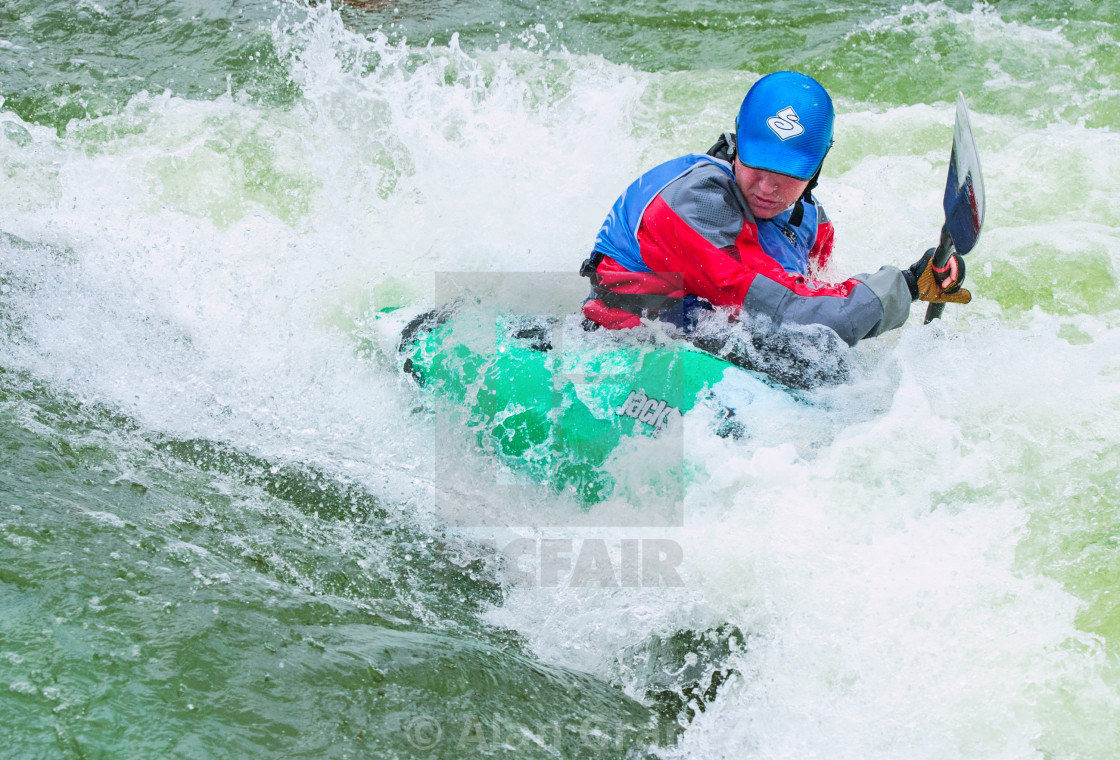 "Kayaker paddling against the flow" by Alan Grant - $15.18 "Kayaker paddling against the flow" stock image