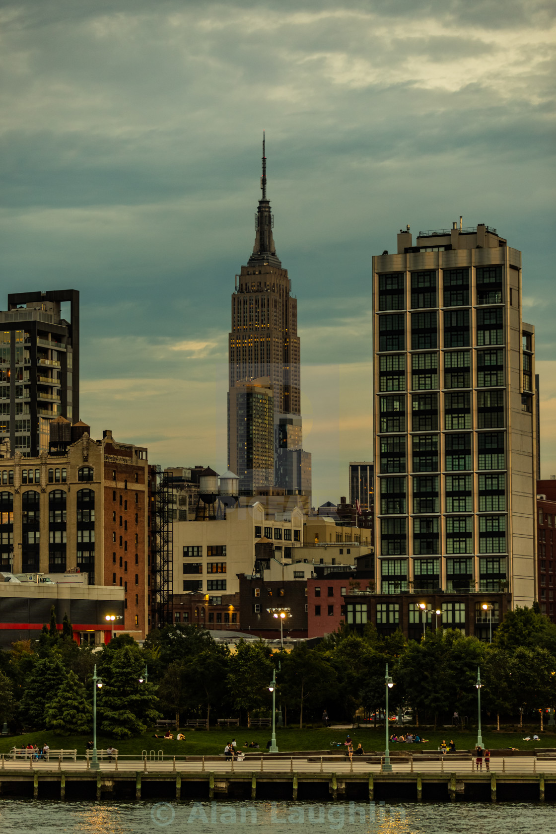 "The Empire State Building with cruiser in foreground from The Hudson River sunset" by Alan Laughlin - $23.13 "The Empire State Building with cruiser in foreground from The Hudson River sunset" stock image