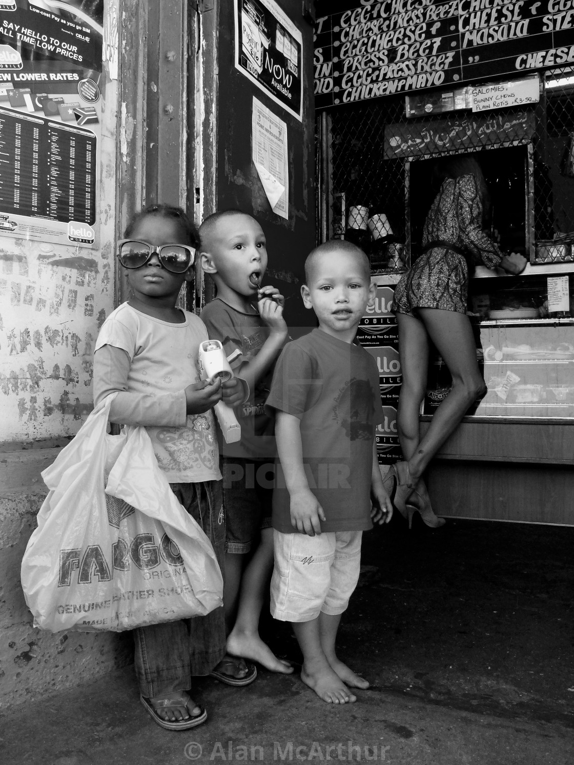 "South African kids at a Shop in Woodstock in Cape Town South Africa" by Alan McArthur - $76.83 "South African kids at a Shop in Woodstock in Cape Town South Africa" stock image
