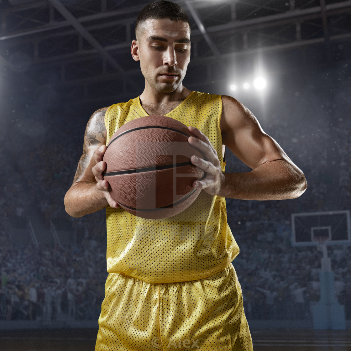 Basketball Player Hold A Ball On Professional Arena License