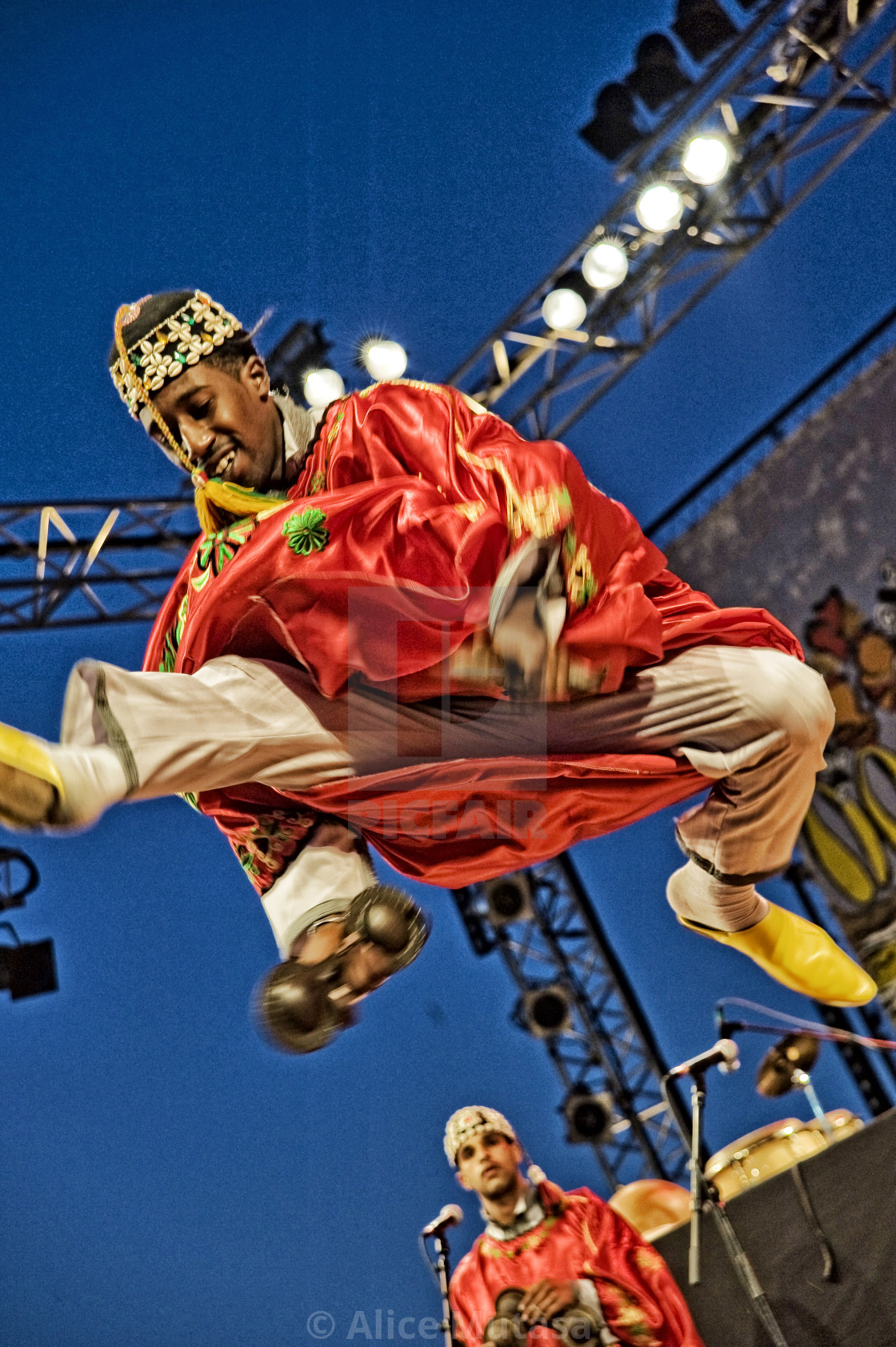 "Gnaoua dancer, Essaouira Gnaoua festival, Morocco" by Alice Mutasa - $31.75 "Gnaoua dancer, Essaouira Gnaoua festival, Morocco" stock image