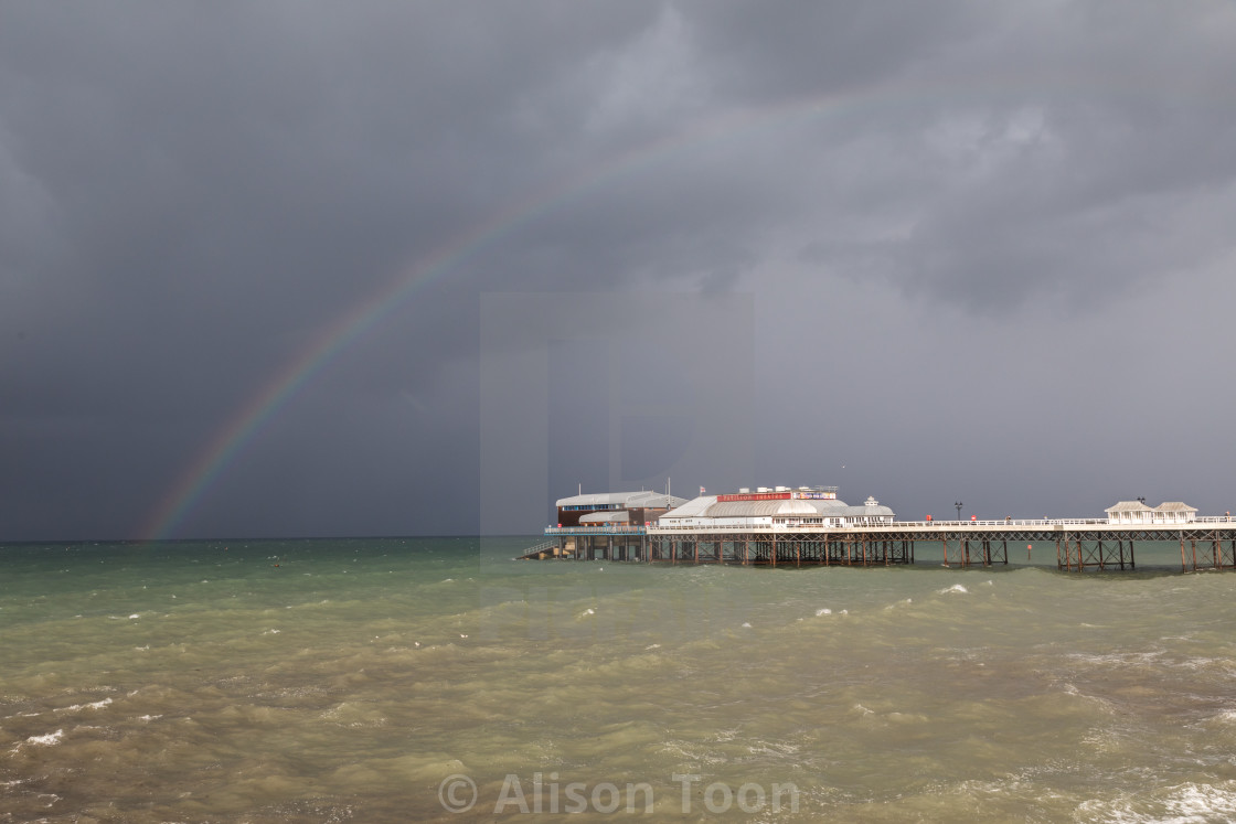 "Rainbow over the North Sea and Cromer Pier" by Alison Toon - £24.80 "Rainbow over the North Sea and Cromer Pier" stock image