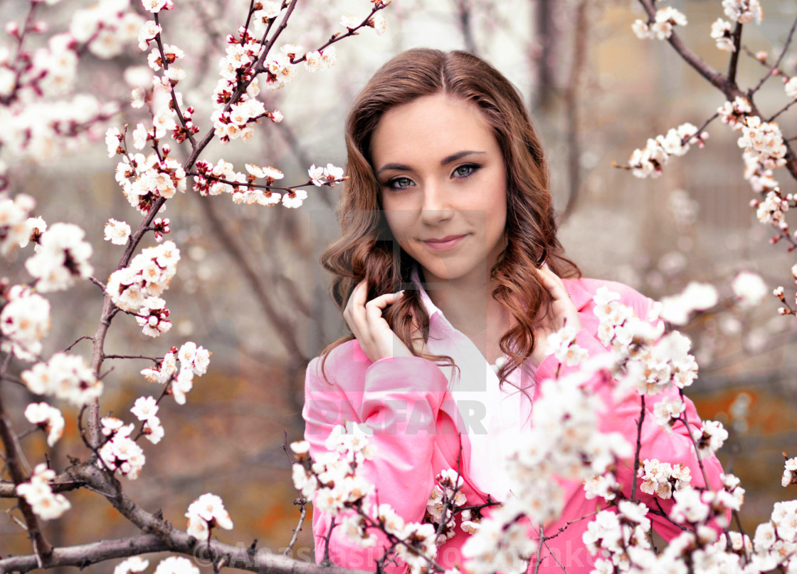 Very beautiful girl in blossoming trees in spring pretty,awesome,gorgeous,nice girl with perfect hairstyle,pink jacket in spring blossoming park with many white . - License, download or print for £ | Very beautiful girl in blossoming trees in spring pretty,awesome,gorgeous,nice girl with perfect hairstyle,pink jacket in spring blossoming park with many white . - License, download or print for £ |