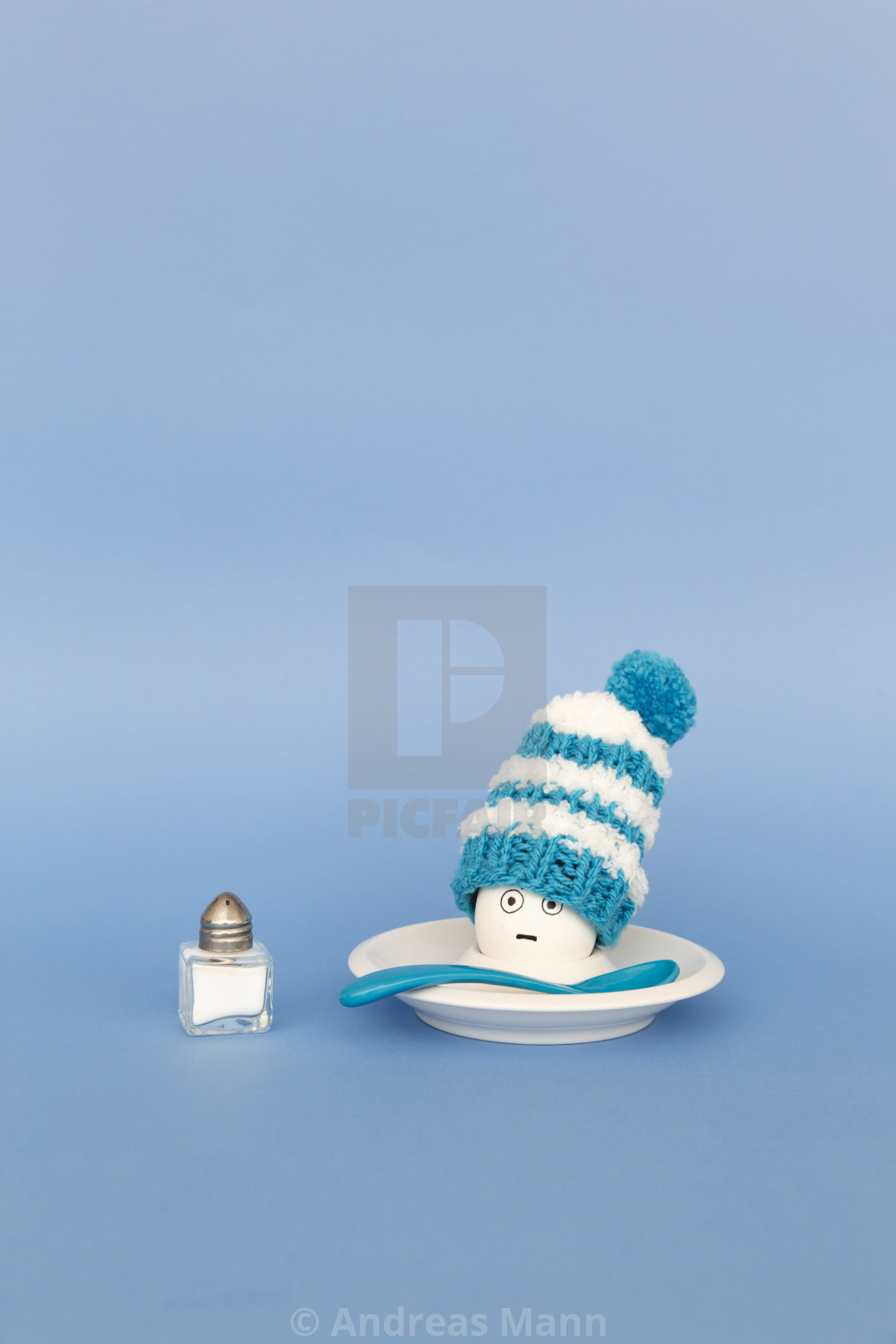 "Funny breakfast concept with a boiled egg wearing a wooly hat" stock image