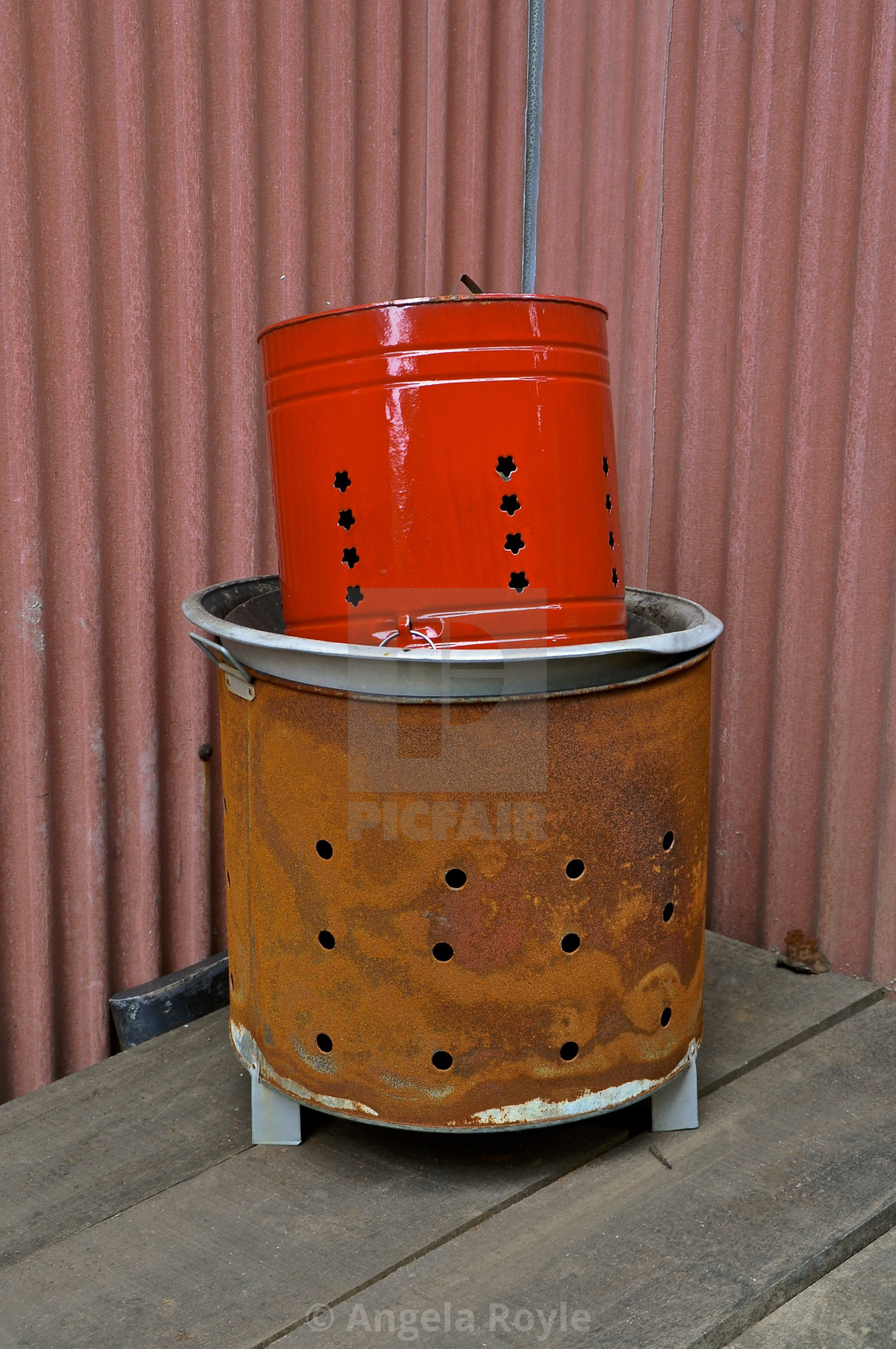 "Red metal offerings bin." stock image