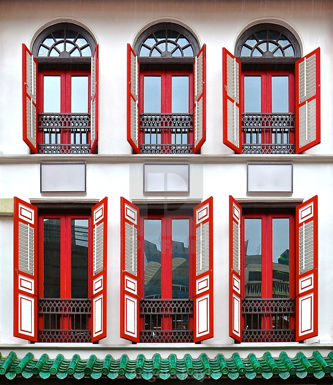 "White peranakan house with red wooden shutters" stock image