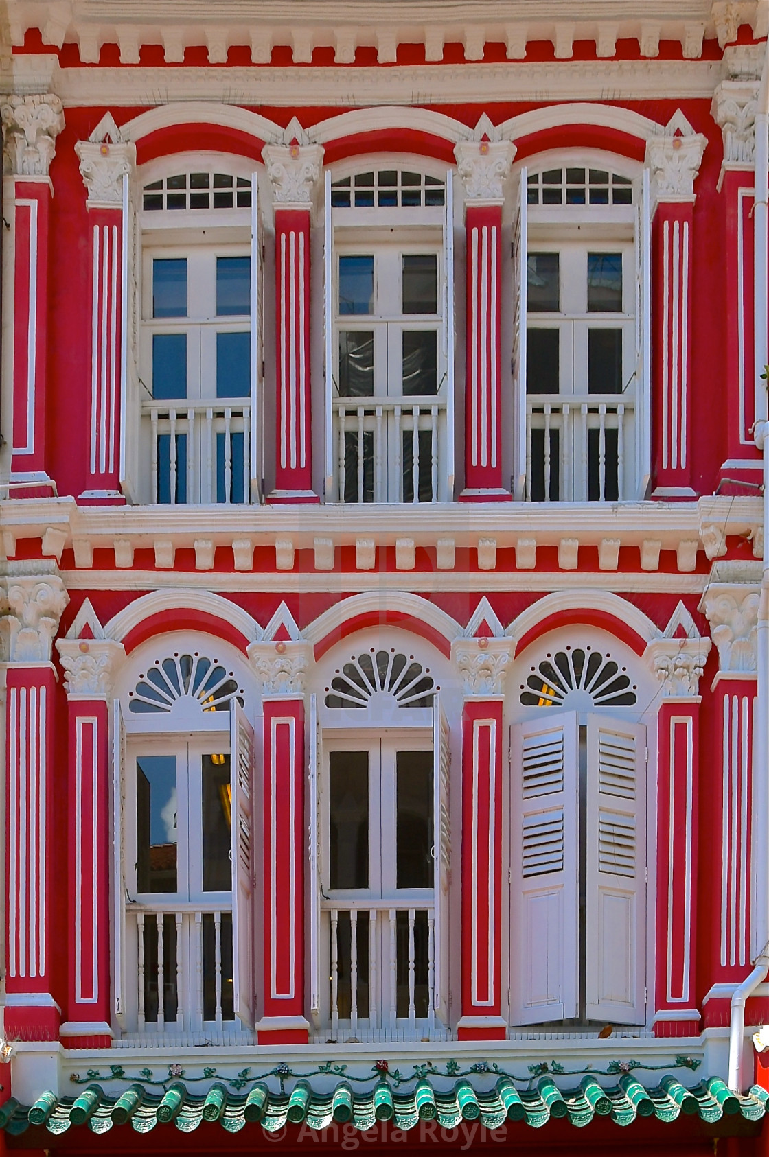 "Red peranakan house with white windows" stock image