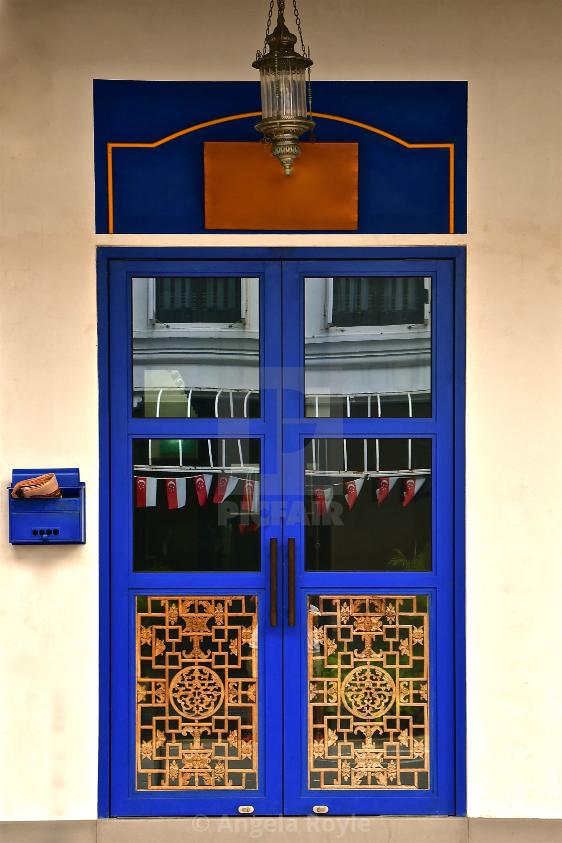 "Blue chinese door on a white wall" stock image