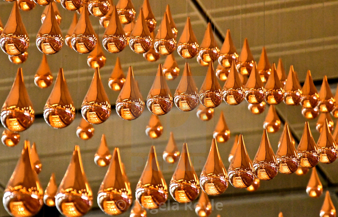 "Rows of suspended bronze droplets" stock image