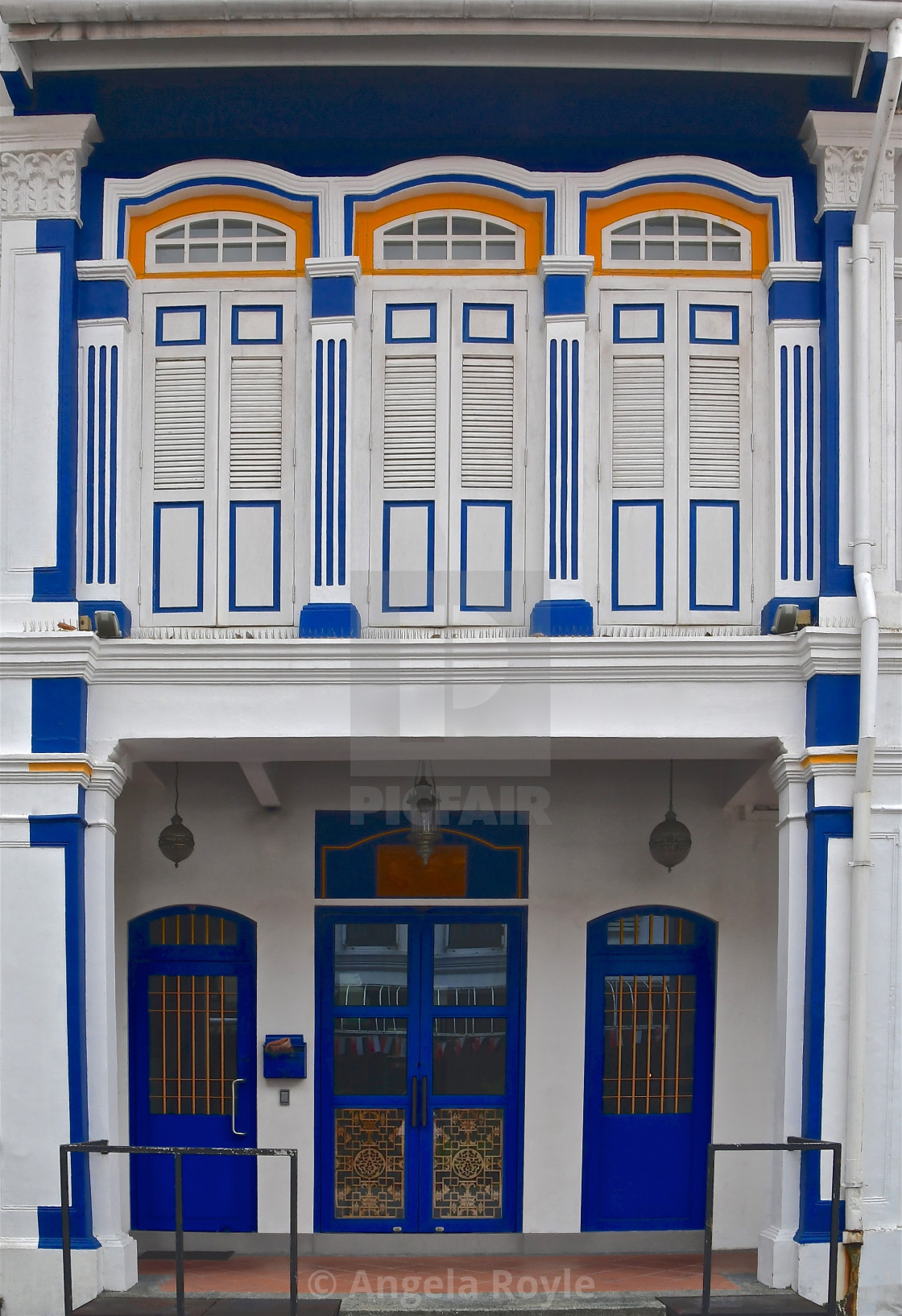 "Restored blue and white peranakan shop house." stock image