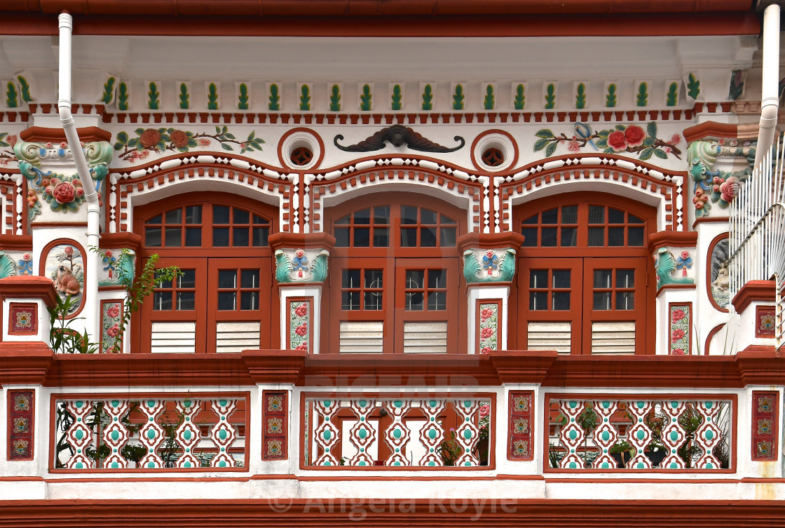 "Restored Pernakan shop house with an ornate balcony." stock image