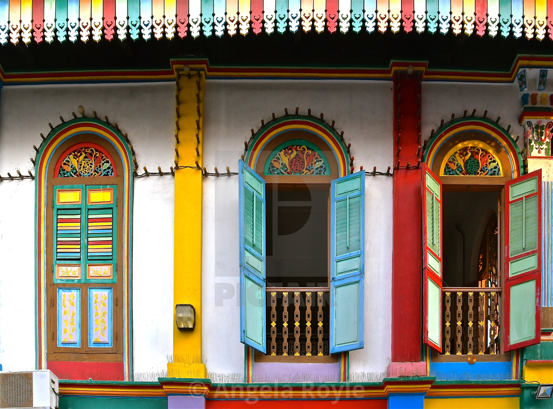 "Restored building with colourful wooden shutters" stock image