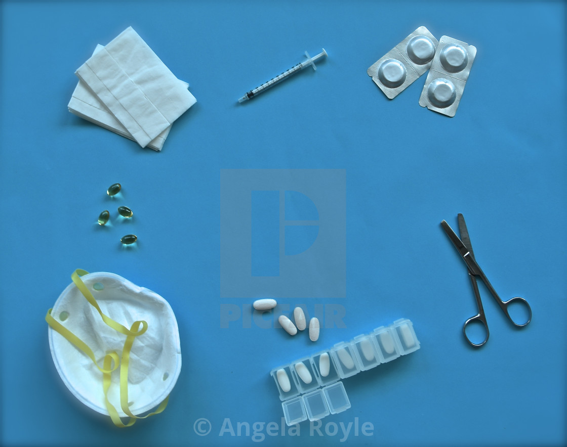 "Medical themed flatlay on blue background." stock image